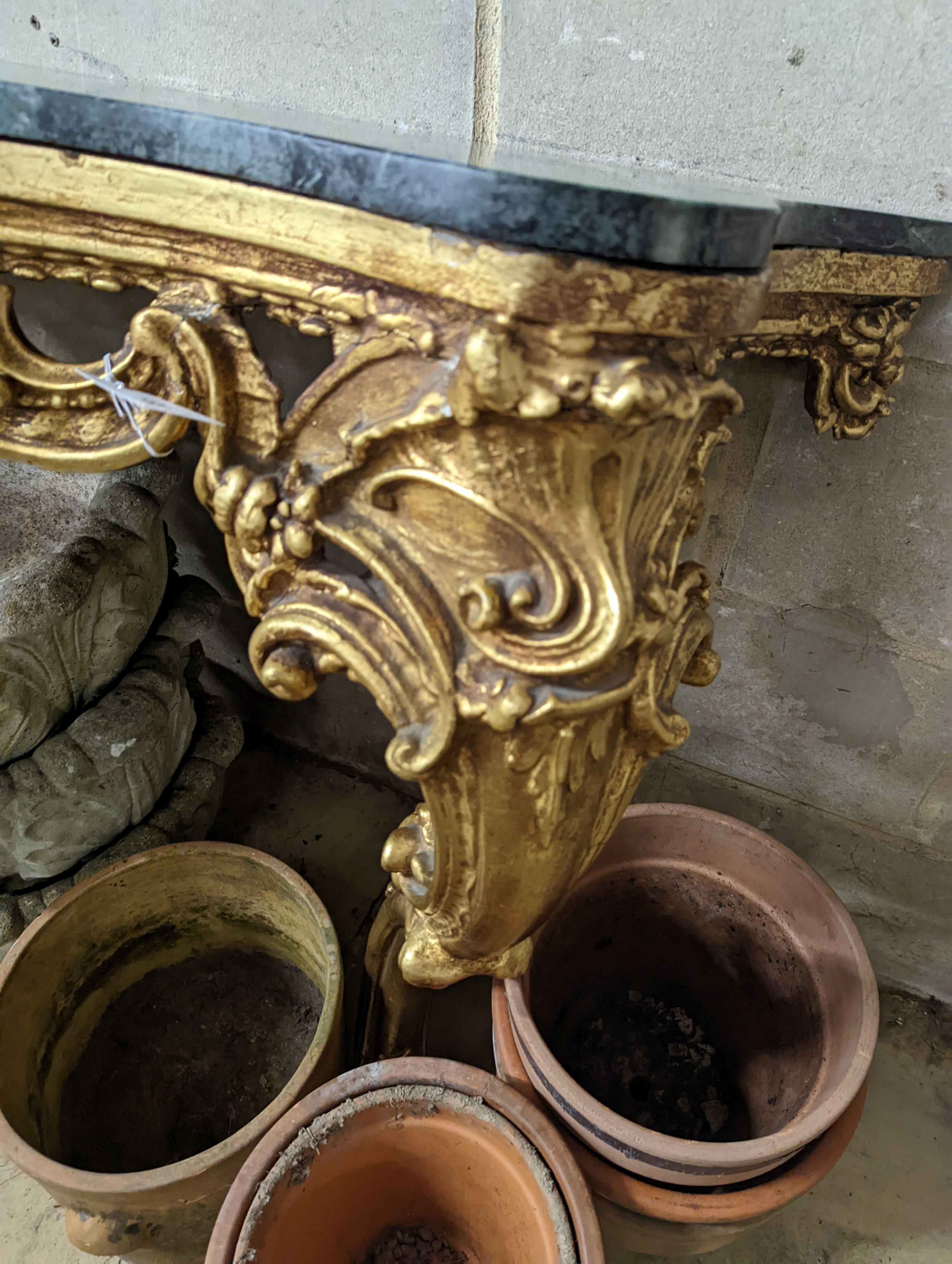 An 18th century style serpentine giltwood marble top console table, width 123cm, height 87cm